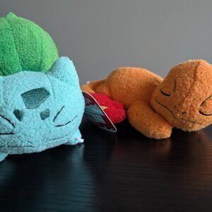 Sleeping Charmander and Bulbasaur plush